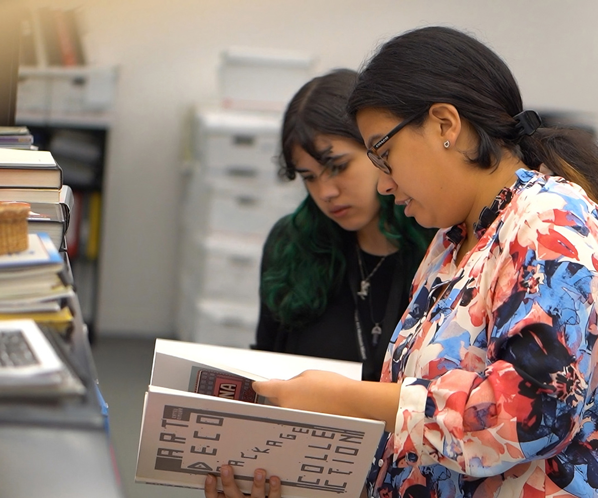 Two students reviewing documents